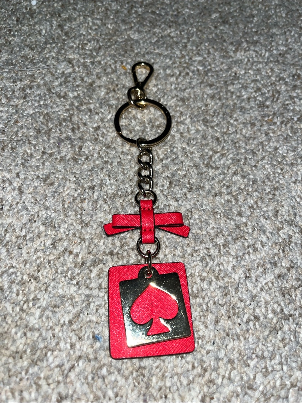 Kate Spade NY live colorfully red and gold spade cutout keychain or bag charm